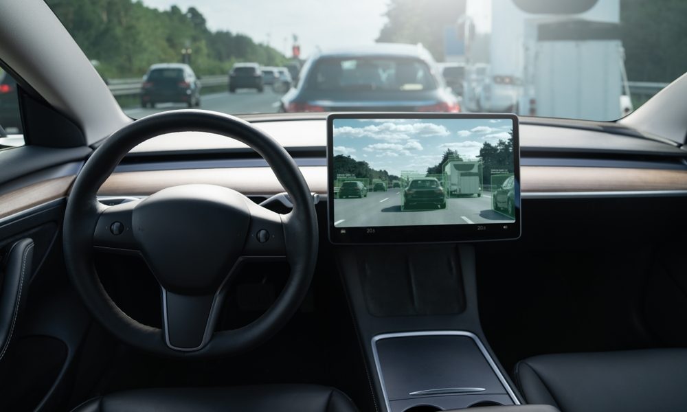 The dashboard of an autonomous vehicle on a highway.