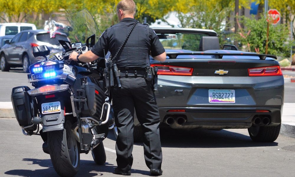 Police officer pulling over a convertible in Arizona.